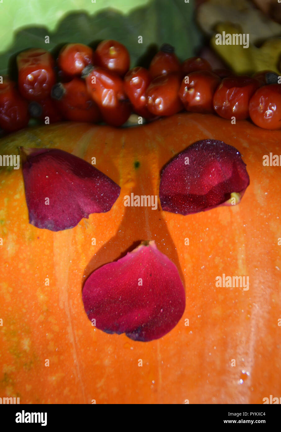 Scary Halloween face from autumn harvest - orange pumpkin, yellow ...