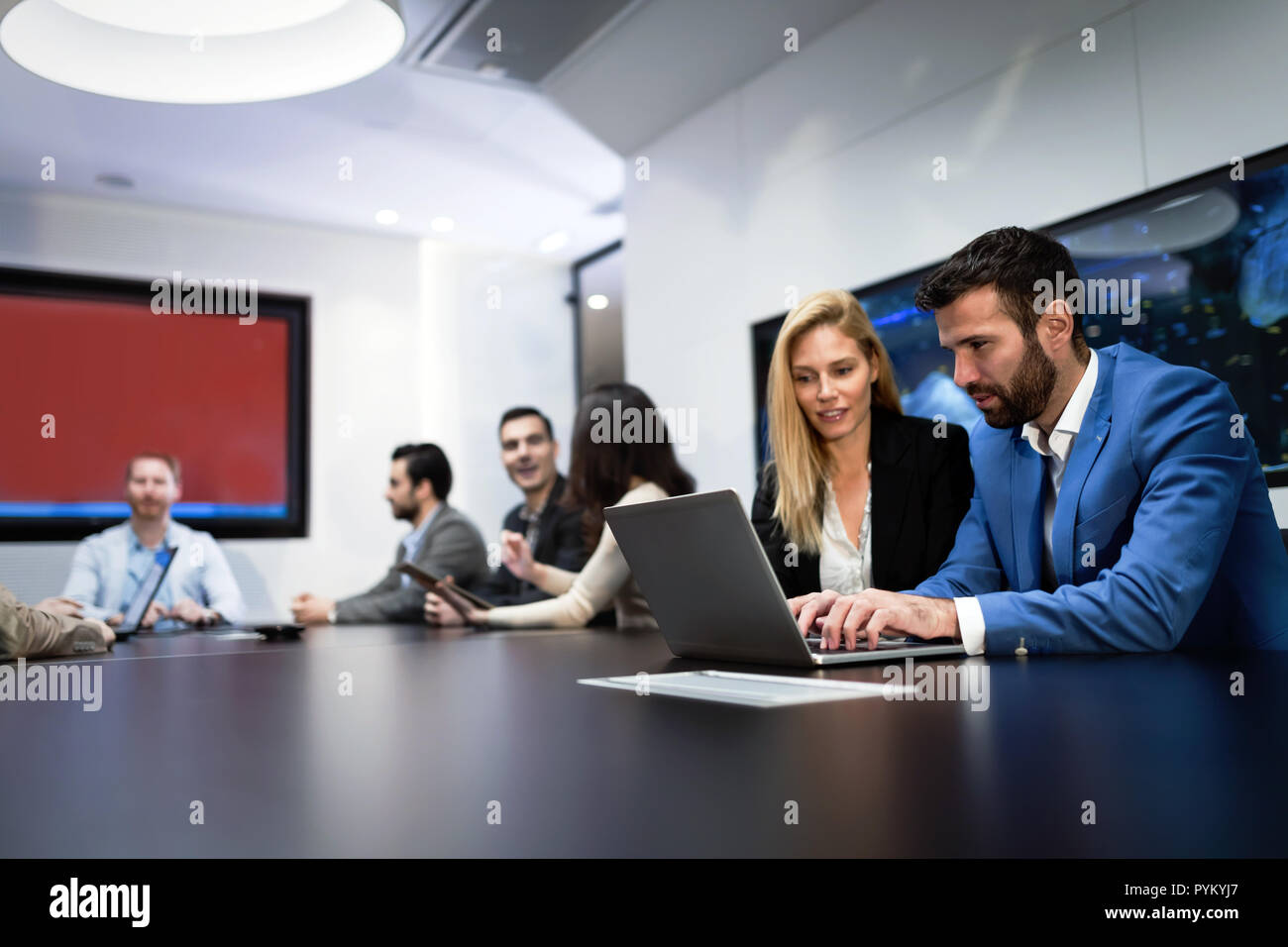 Picture of business couple working on laptop Stock Photo