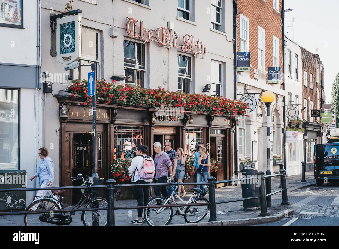 London, UK - August 1, 2018. People walking in front of The Old Ship pub in Richmond, a suburban town in south-west London famous for a large number o Stock Photo