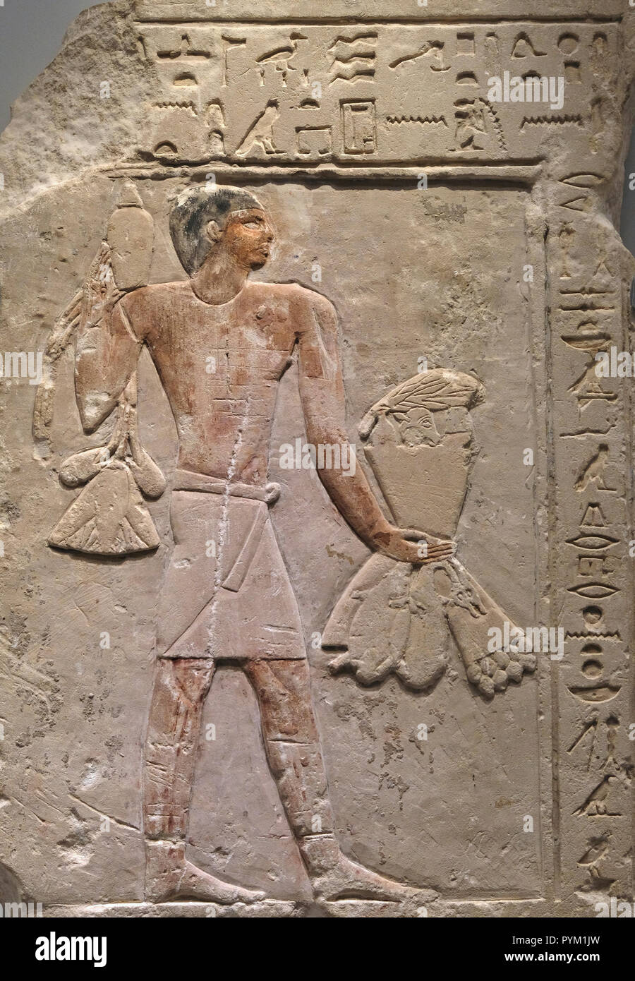 Detail Of 26th 25th Century e Fragmentary Painted Limestone Tomb Relief Depicting An Offering Bearer Carrying Provisions And Inscribed With A Magical Formula Displayed At The Archeology Wing In The Israel Museum In