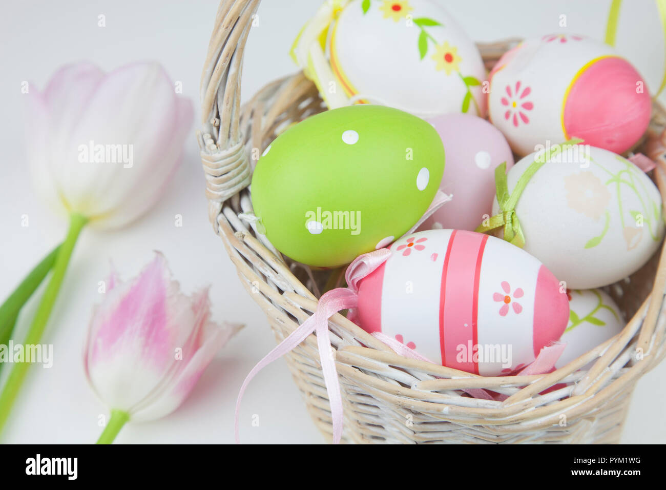 Studio shot of decorated Easter eggs in a wicker basket Stock Photo Alamy