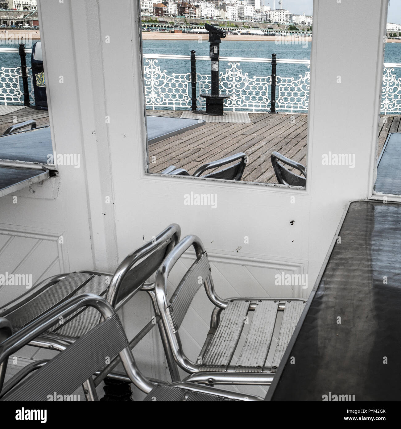 sheltered seating Palace pier ,Brighton sussex Britain, liesure pier boardwalk Stock Photo