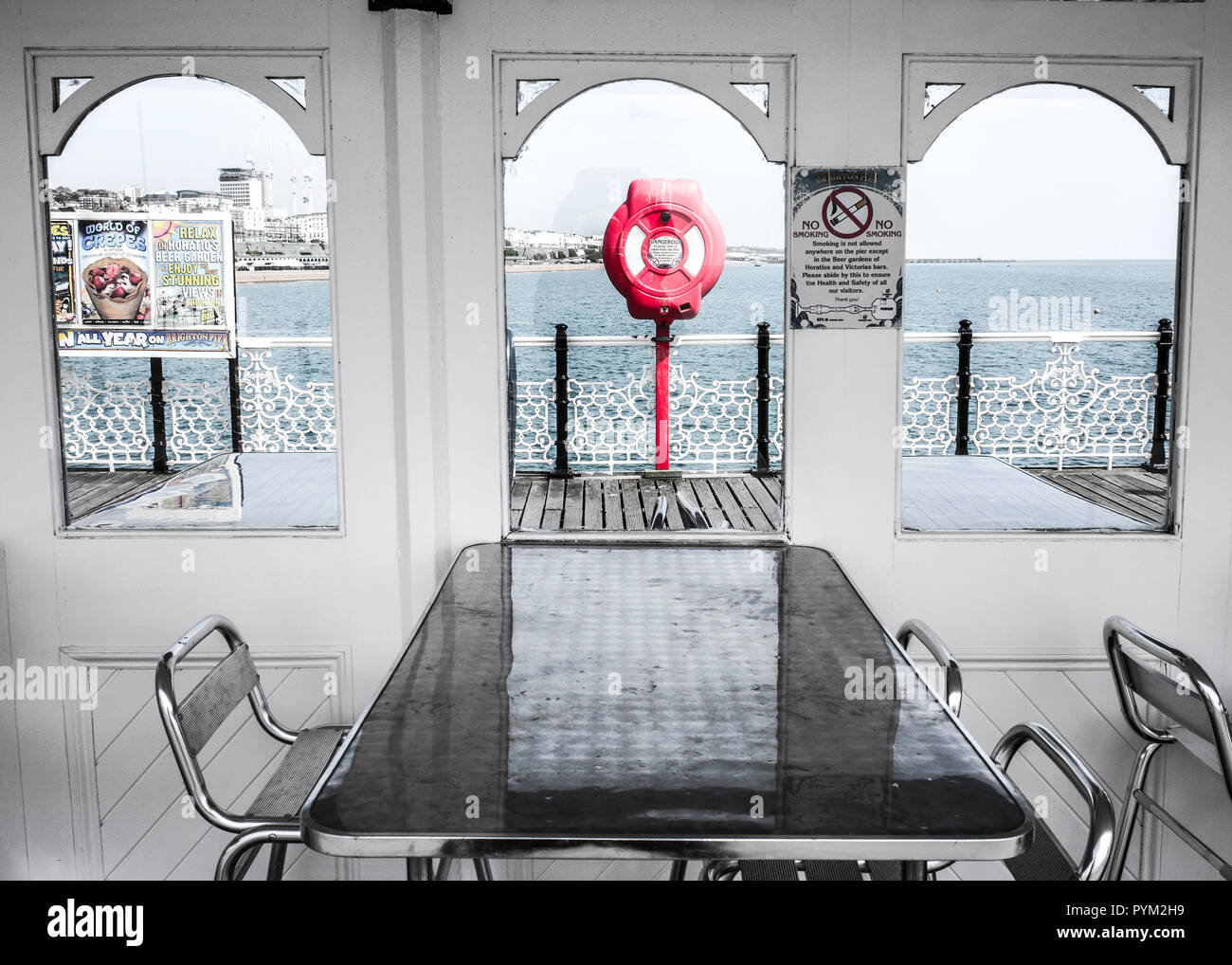 sheltered seating Palace pier ,Brighton sussex Britain, liesure pier boardwalk Stock Photo