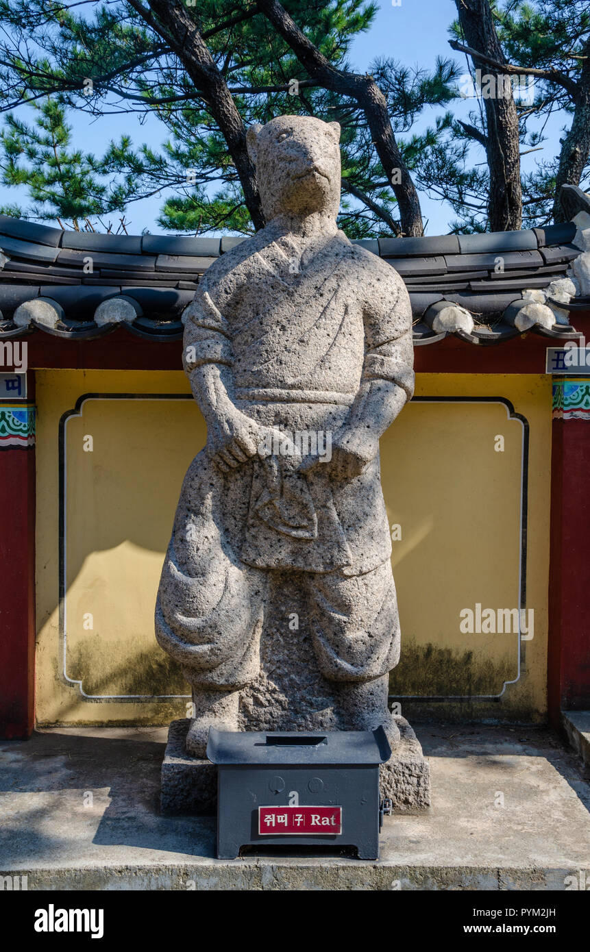 Stone sculpture representing the rat deity from the Chinses Zodiac, seen here at Haedong Yonggung Temple, Busan, South Korea. Stock Photo