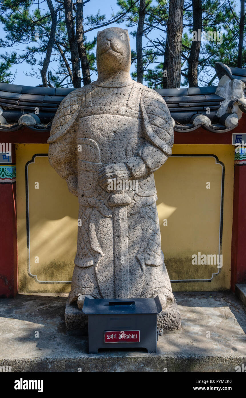 Stone sculpture representing the rabbit deity from the Chinses Zodiac, seen here at Haedong Yonggung Temple, Busan, South Korea. Stock Photo