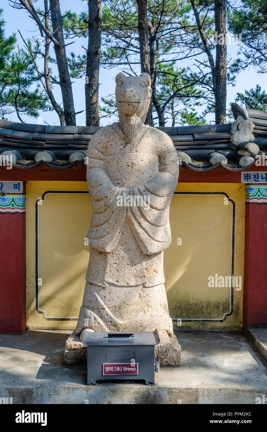 Stone sculpture representing the sheep deity from the Chinses Zodiac, seen here at Haedong Yonggung Temple, Busan, South Korea. Stock Photo