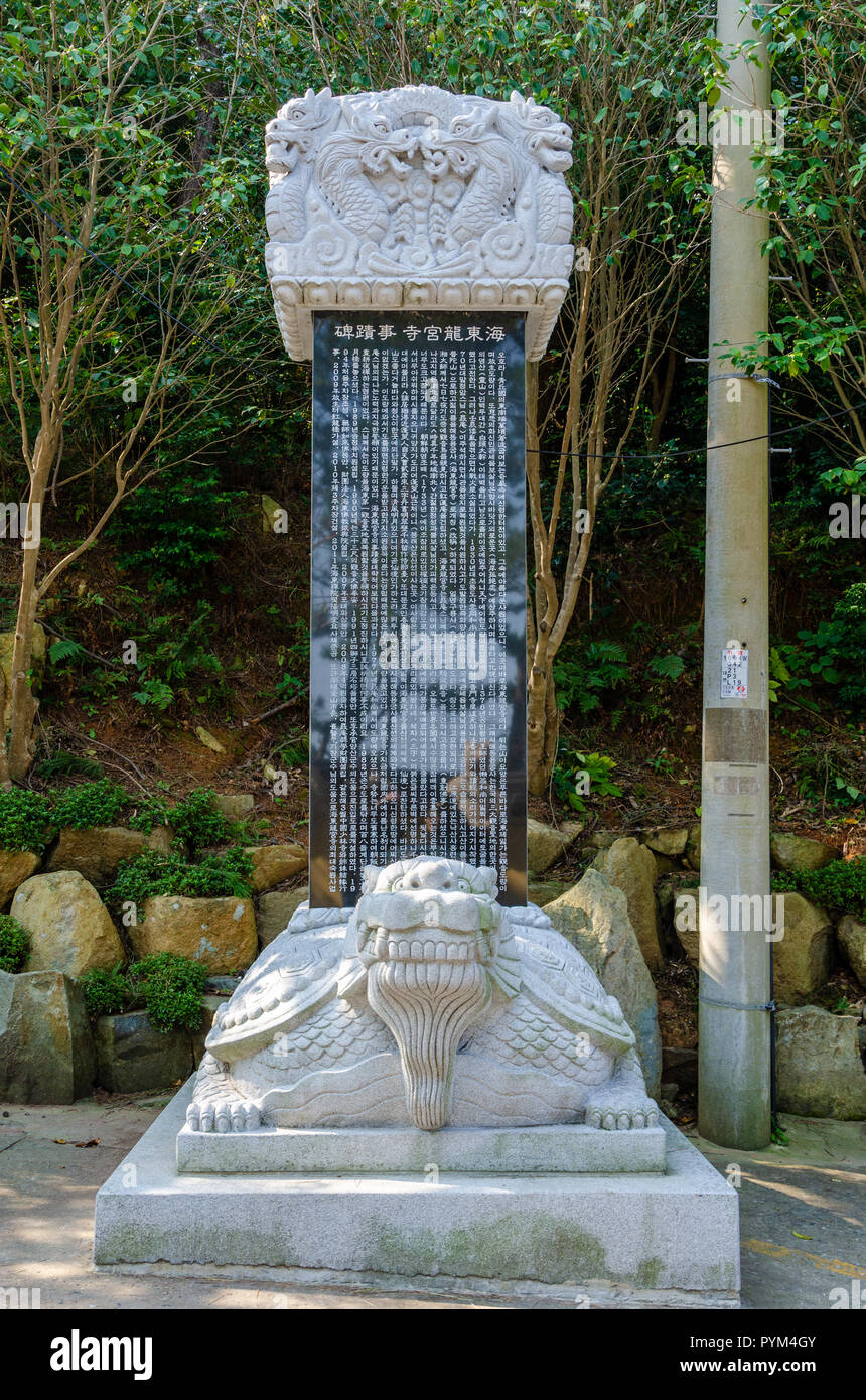 A monument of a column on the back of a stone turtle at Haedong Yonggung Temple in Busan, South Korea. Stock Photo
