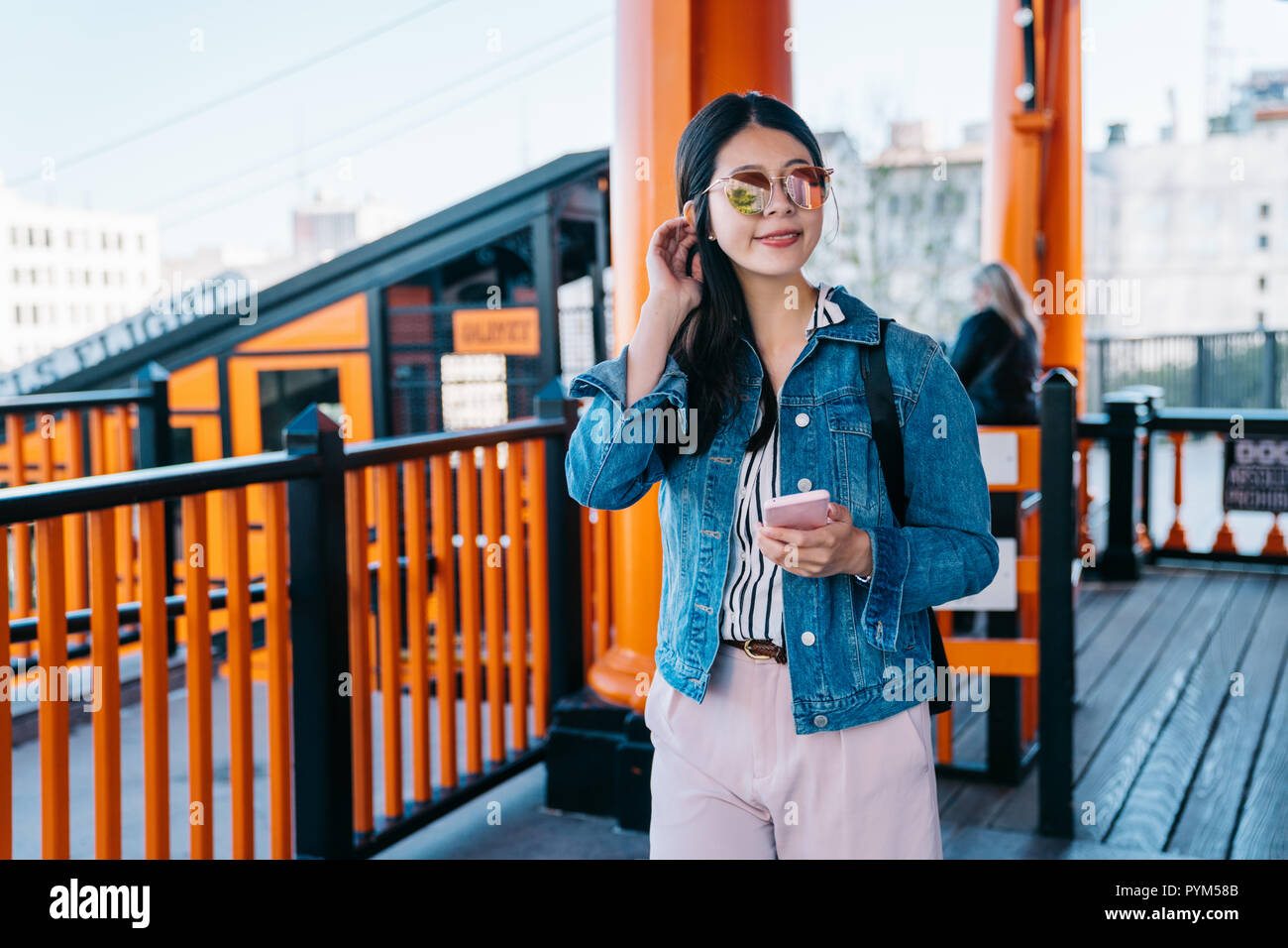 female traveler got off the railcar and walking out of the Angels flight railway station. fun things to do in los angeles. Happy travel in sunny city  Stock Photo