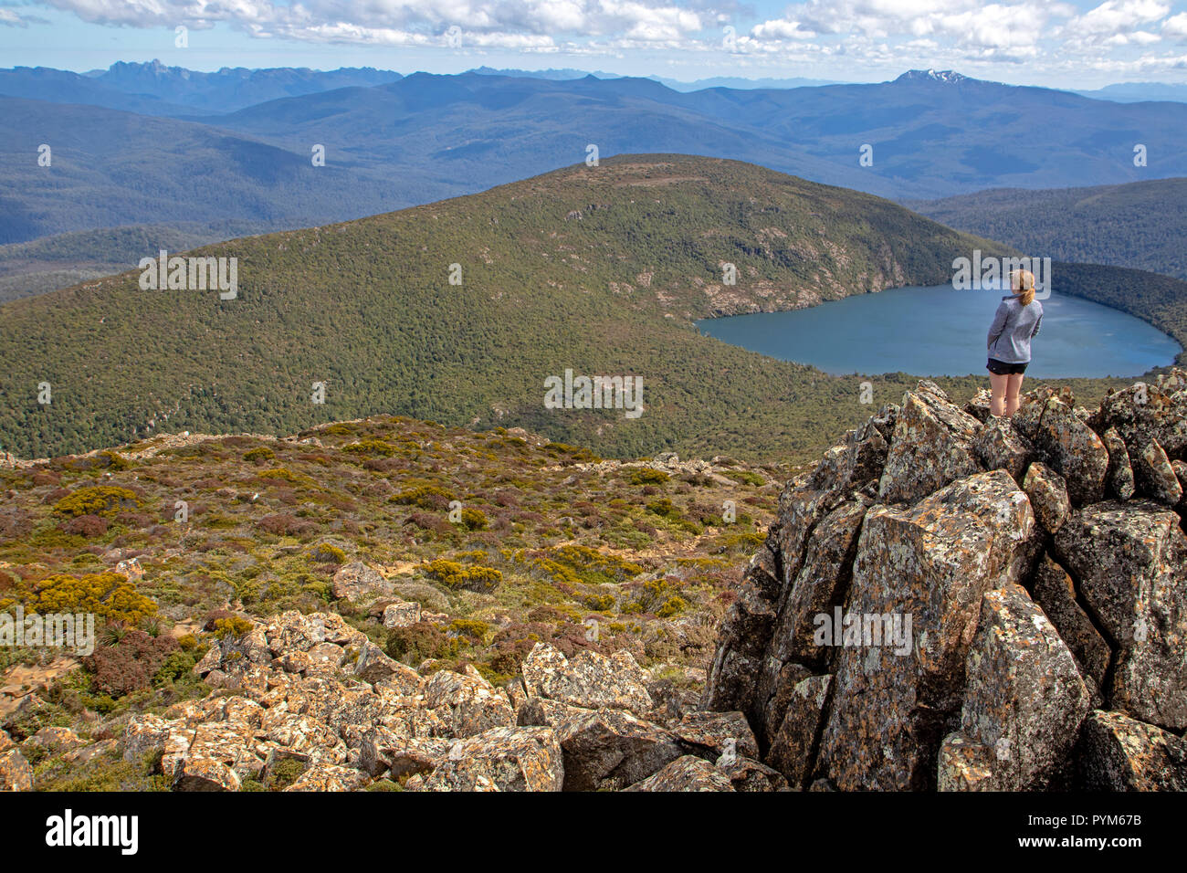 Girl standing above Hartz Lake in the Hartz Mountains Stock Photo