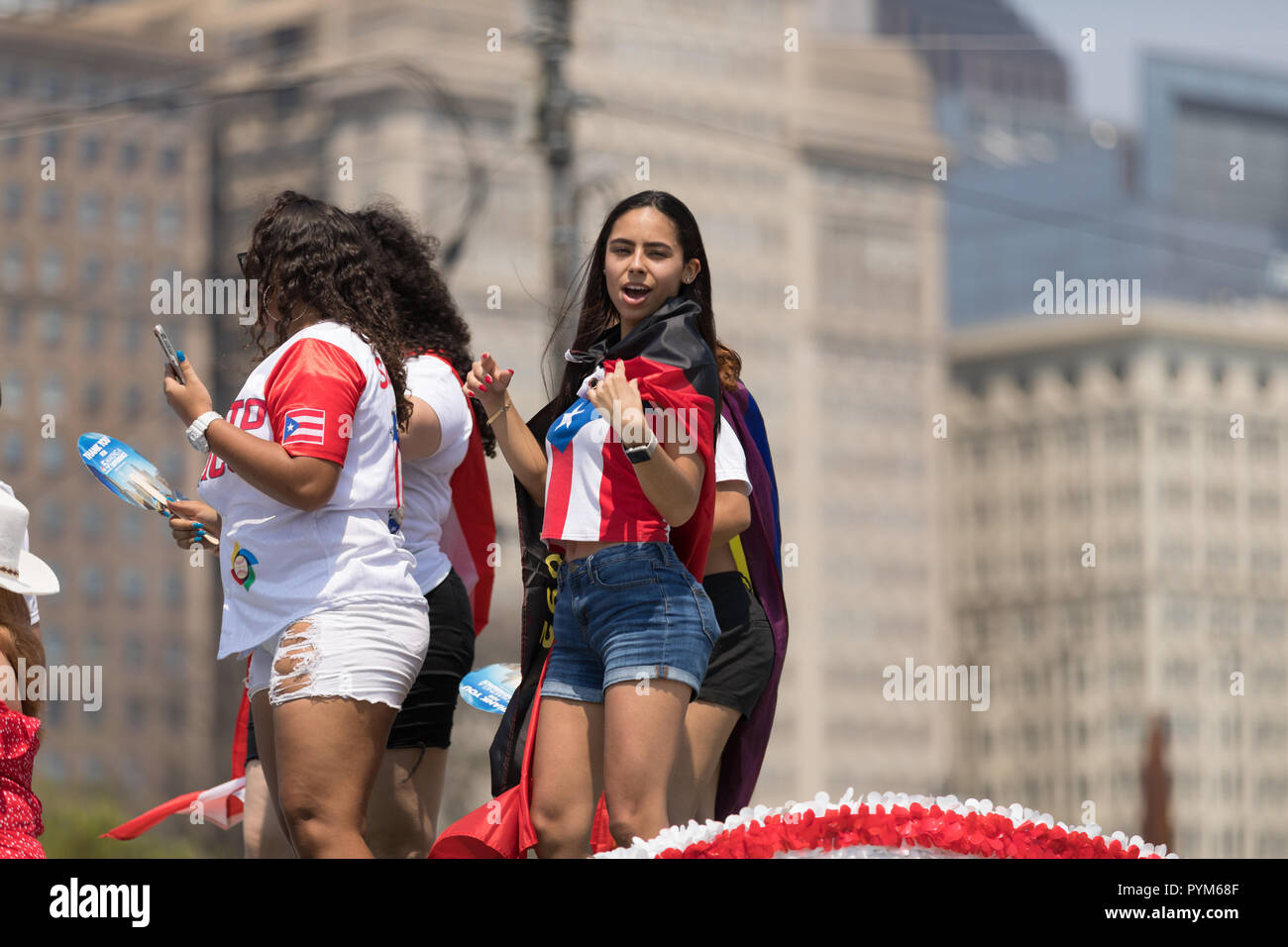 Chicago, Illinois, USA - June 16, 2018: The Puerto Rican Day Parade, Puerto rican woman wearing a shirt with the colors of the puerto rican flag on to Stock Photo