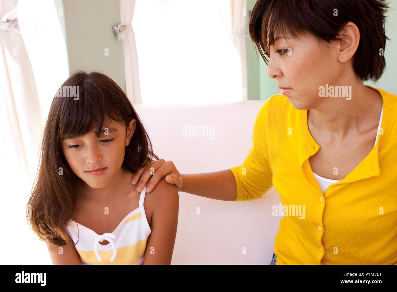 Portrait of a mother and daughter hugging Stock Photo