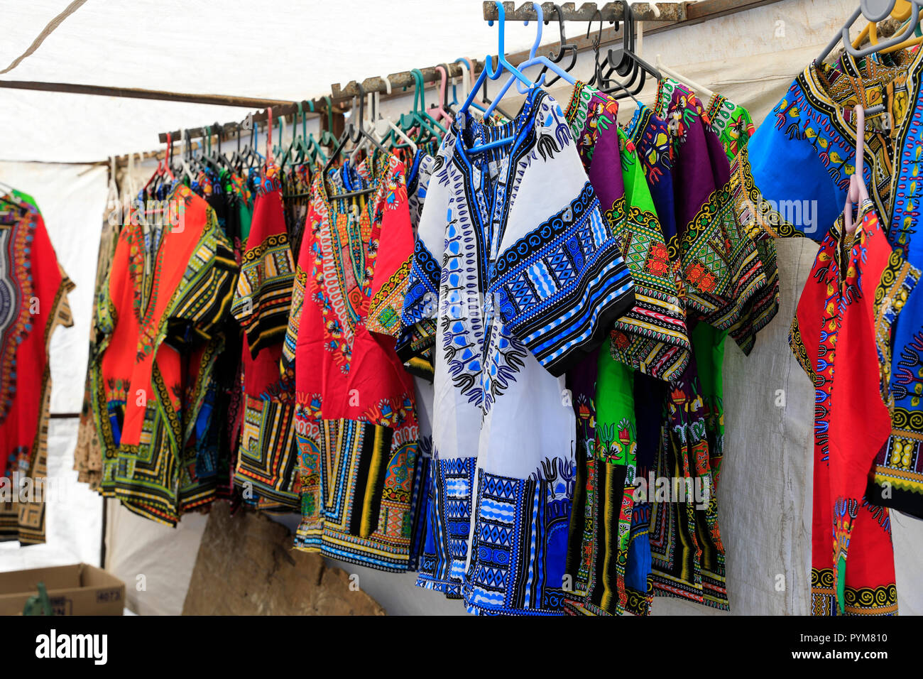 Colourful African print shirts for sale at the docks in Hout Bay Harbour near Cape Town, South Africa. Stock Photo