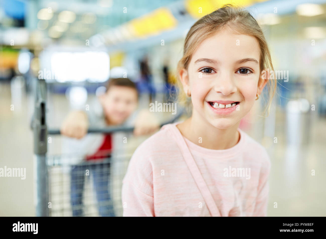 Happy girl is looking forward to the air travel in the summer vacation