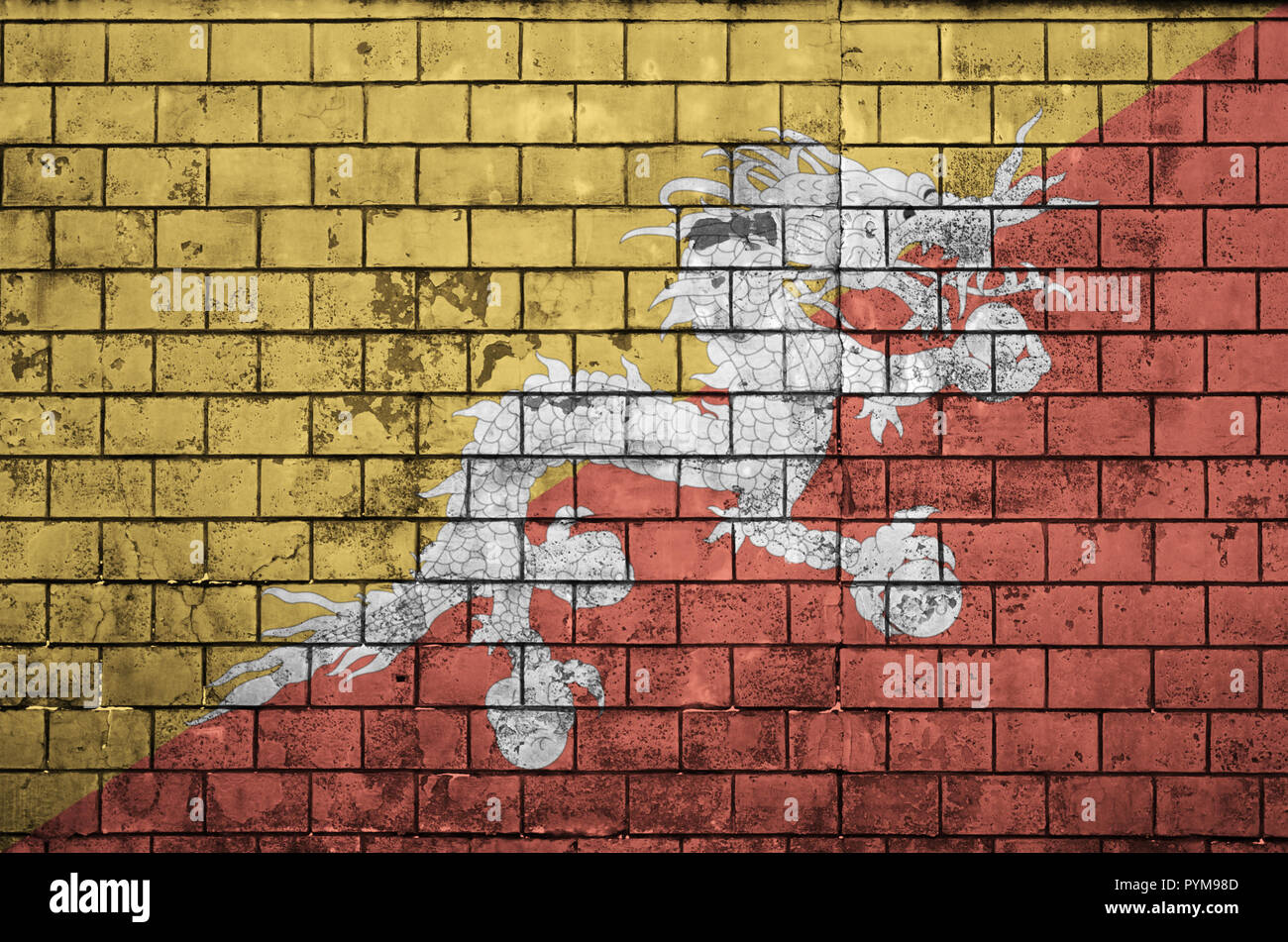 Bhutan flag is painted onto an old brick wall Stock Photo - Alamy