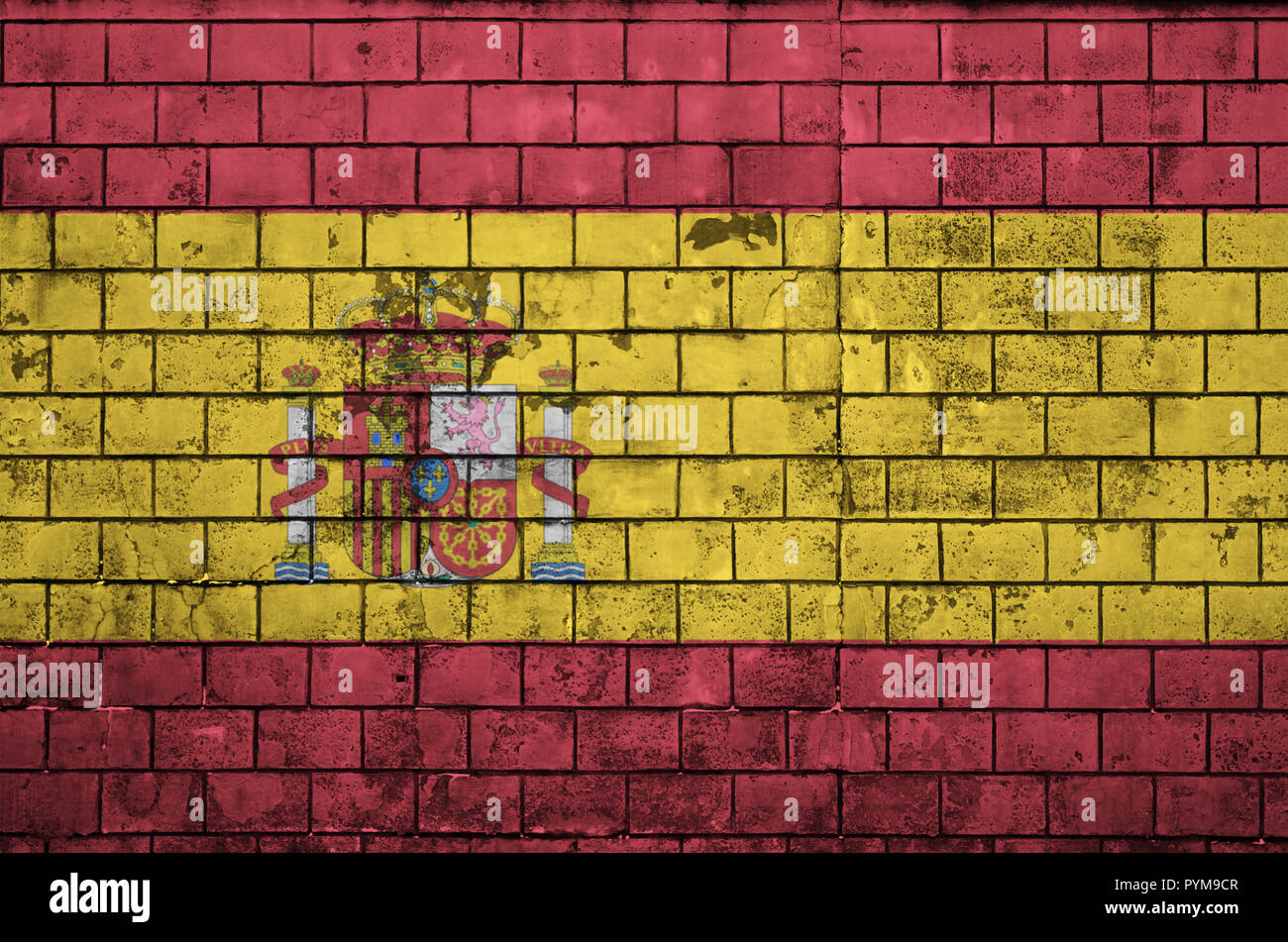 Spain flag is painted onto an old brick wall Stock Photo - Alamy