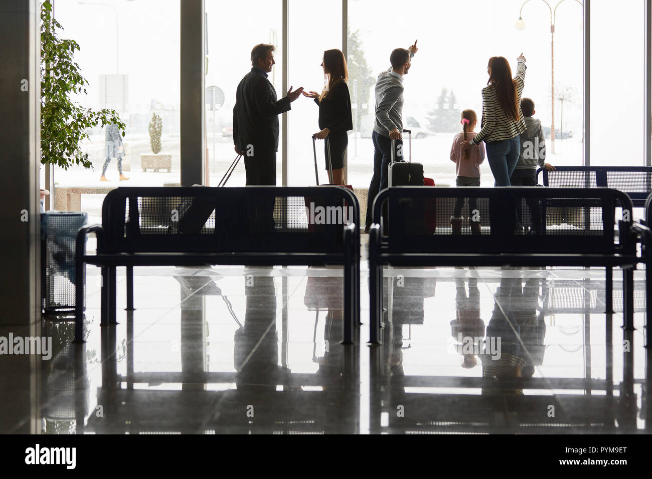 Family and business people as travelers in the airport terminal are waiting in the rest area Stock Photo