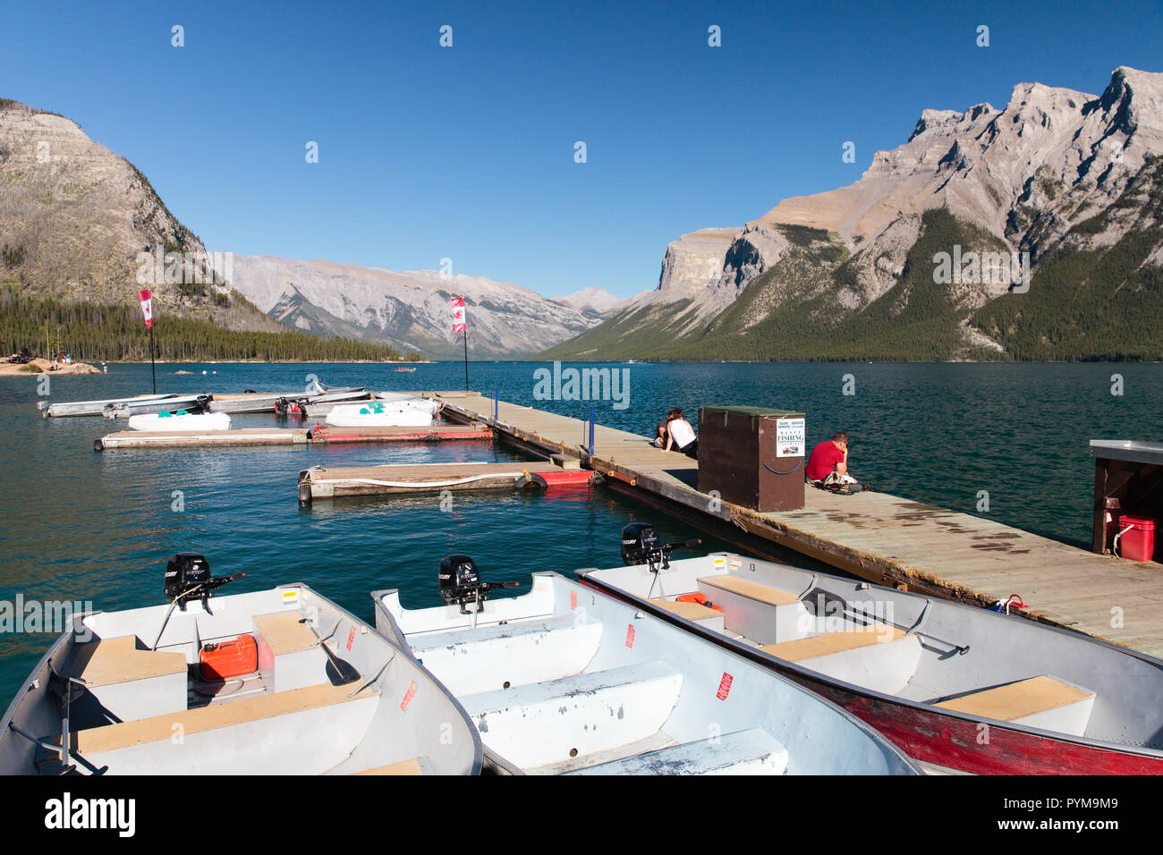 Boats on Lake Minnewanka in the Canadian Rocky Mountains, Alberta, Canada Stock Photo