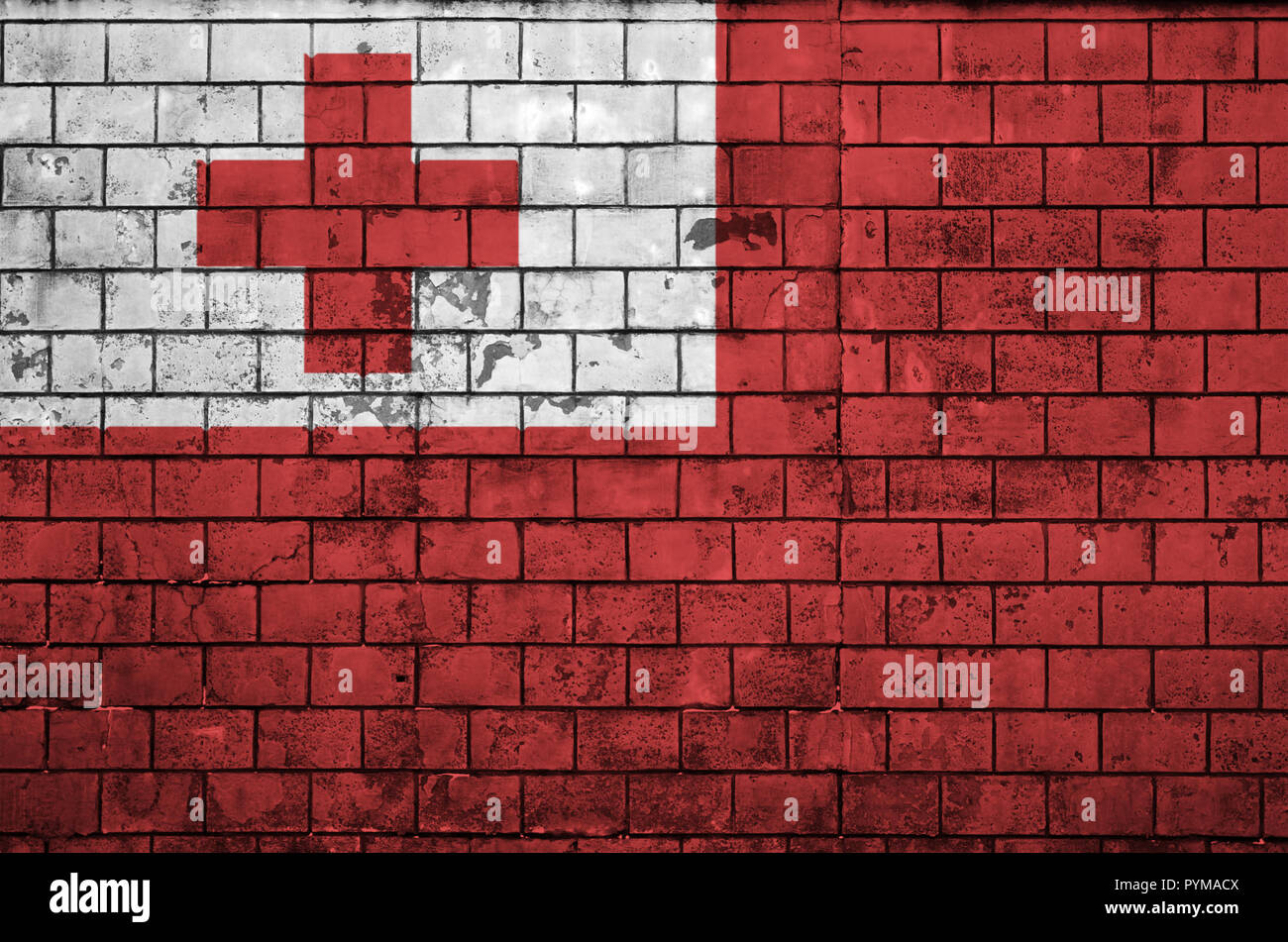 Tonga flag is painted onto an old brick wall Stock Photo - Alamy