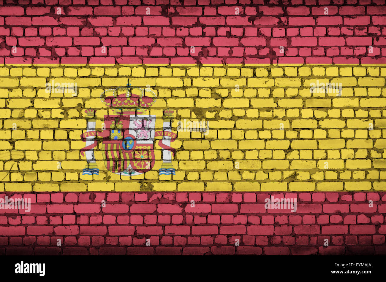 Spain flag is painted onto an old brick wall Stock Photo - Alamy