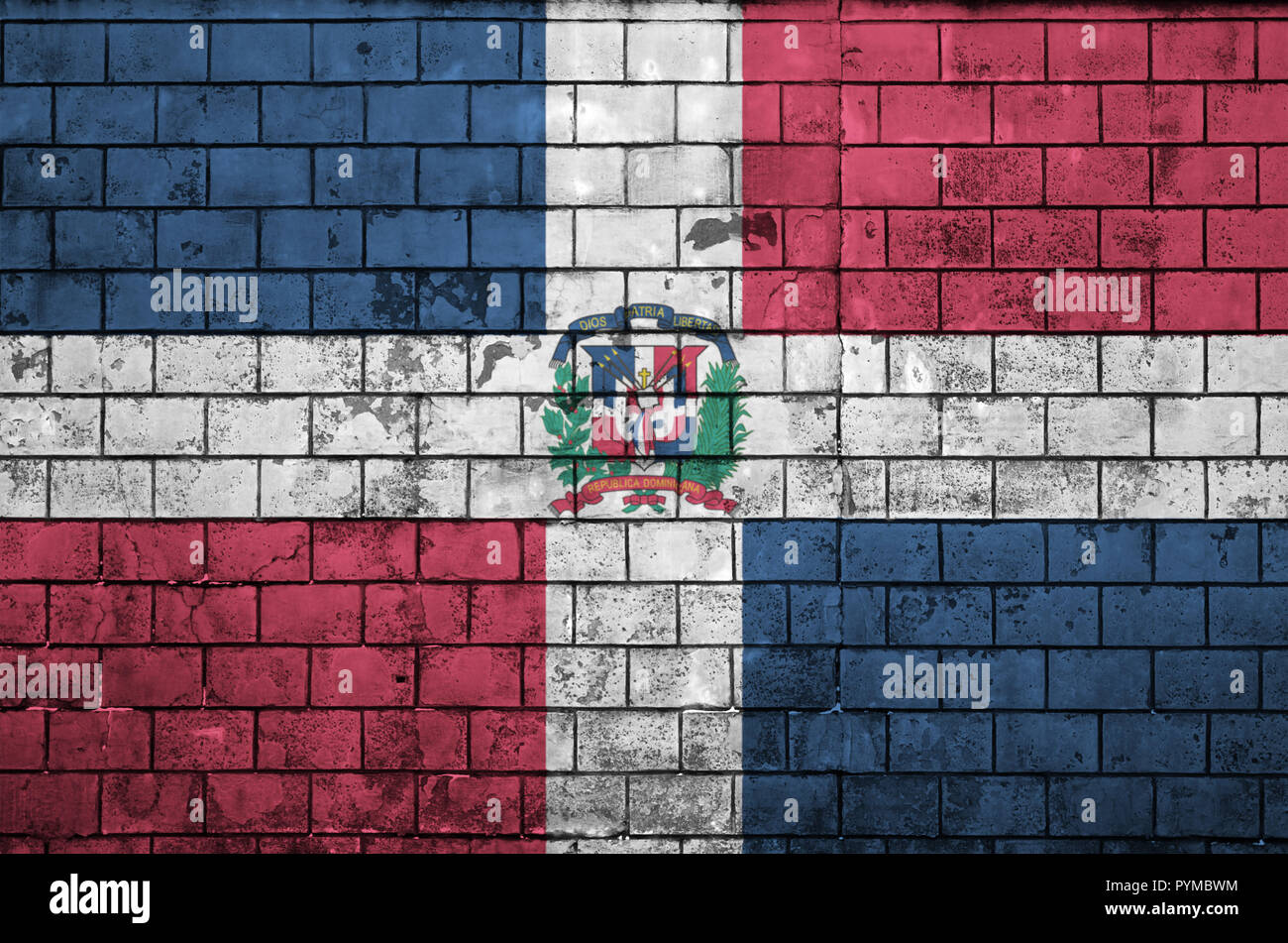 Dominican Republic flag is painted onto an old brick wall Stock Photo ...