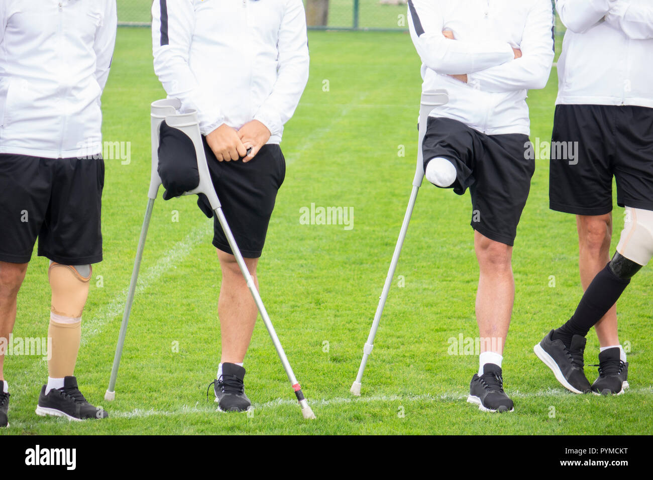 close-up of ampute soccer player and team friends Stock Photo - Alamy