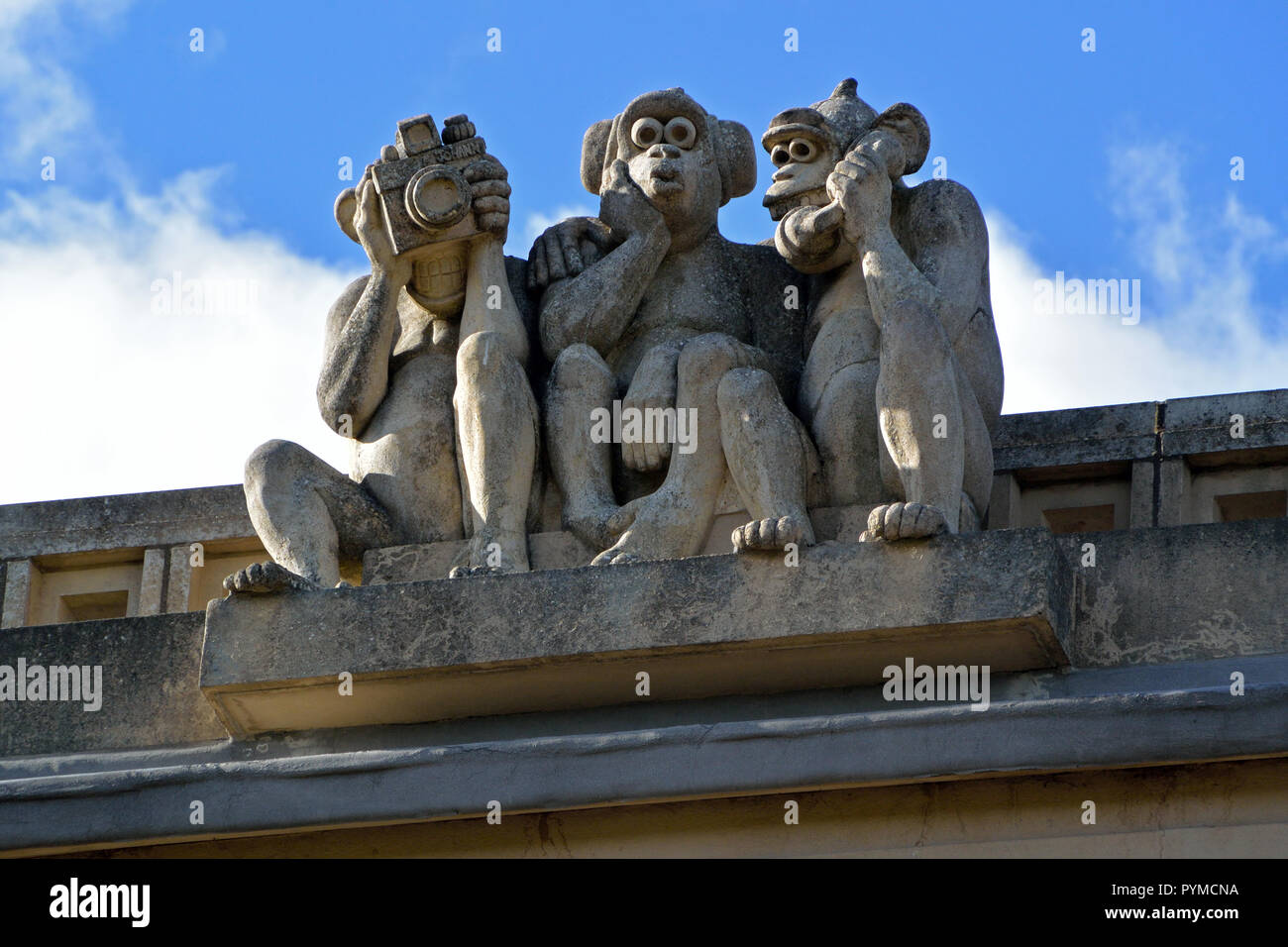 Three Wise Monkeys sculpture on the roof of Waterloo Park Pavilion, Norwich, Norfolk, UK Stock Photo