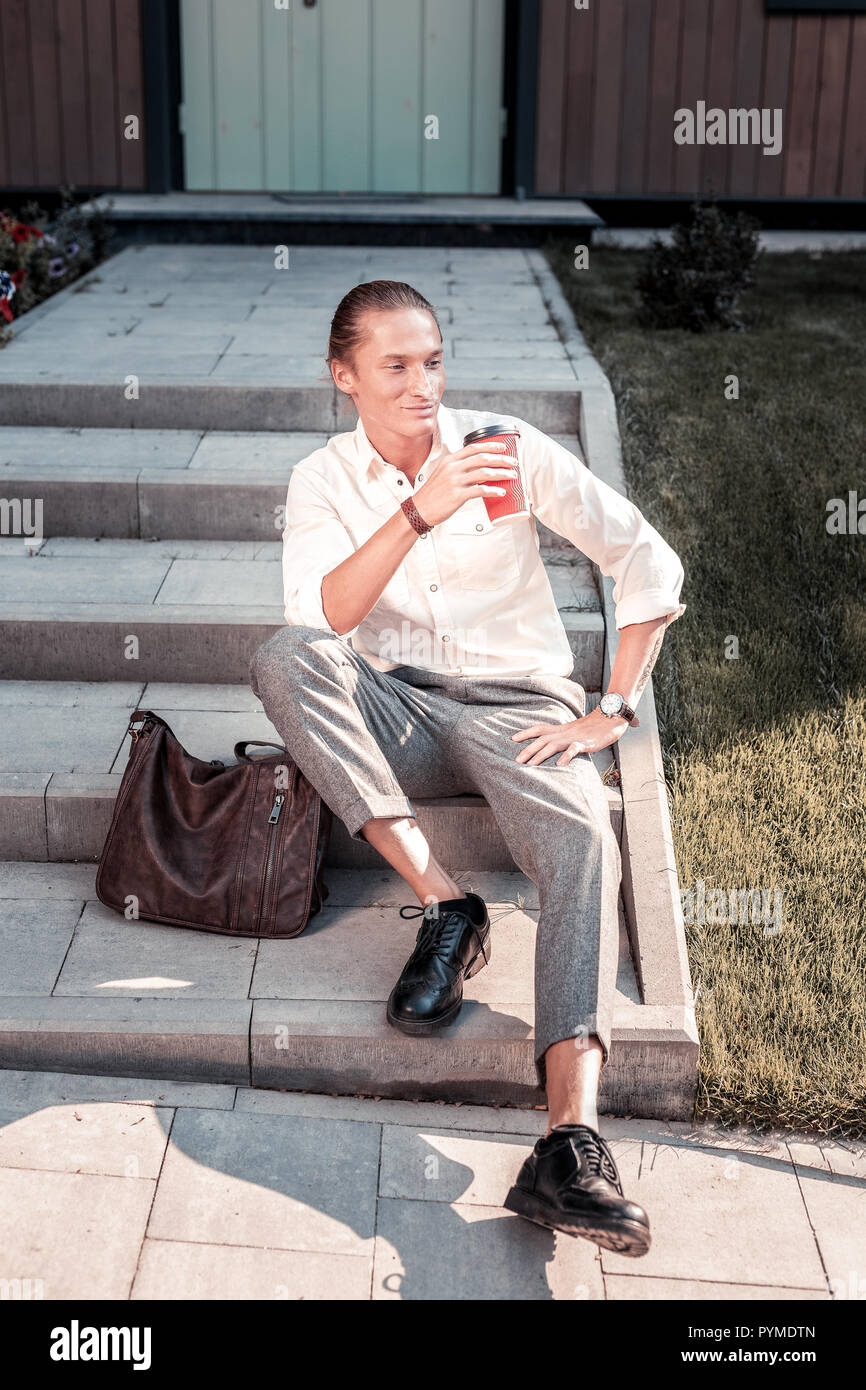 Man sitting stairs morning hi-res stock photography and images - Alamy