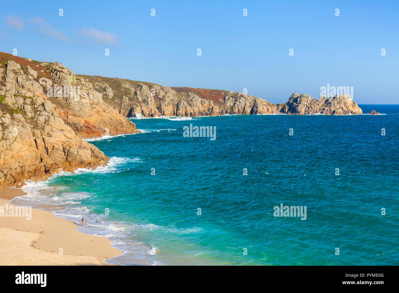 Cornwall Porthcurno beach One swimmer braving the cold water to swim from Porthcurno Cornwall England UK GB Europe Stock Photo