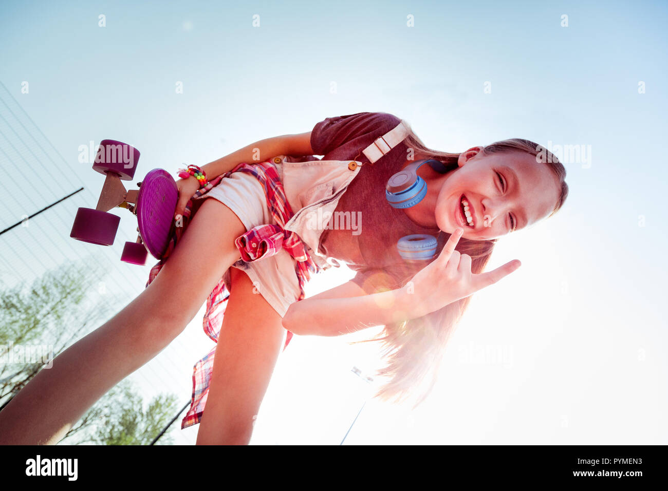 Positive delighted girl looking at camera with pleasure Stock Photo - Alamy