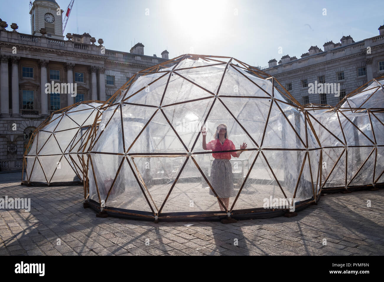 FIVE 3M-HIGH DOMES IN SOMERSET HOUSES COURTYARD RECREATE THE AIR OF WORLDWIDE CITIES Stock Photo