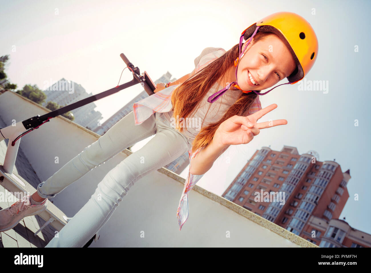 Low angle picture of teenager that posing on camera Stock Photo