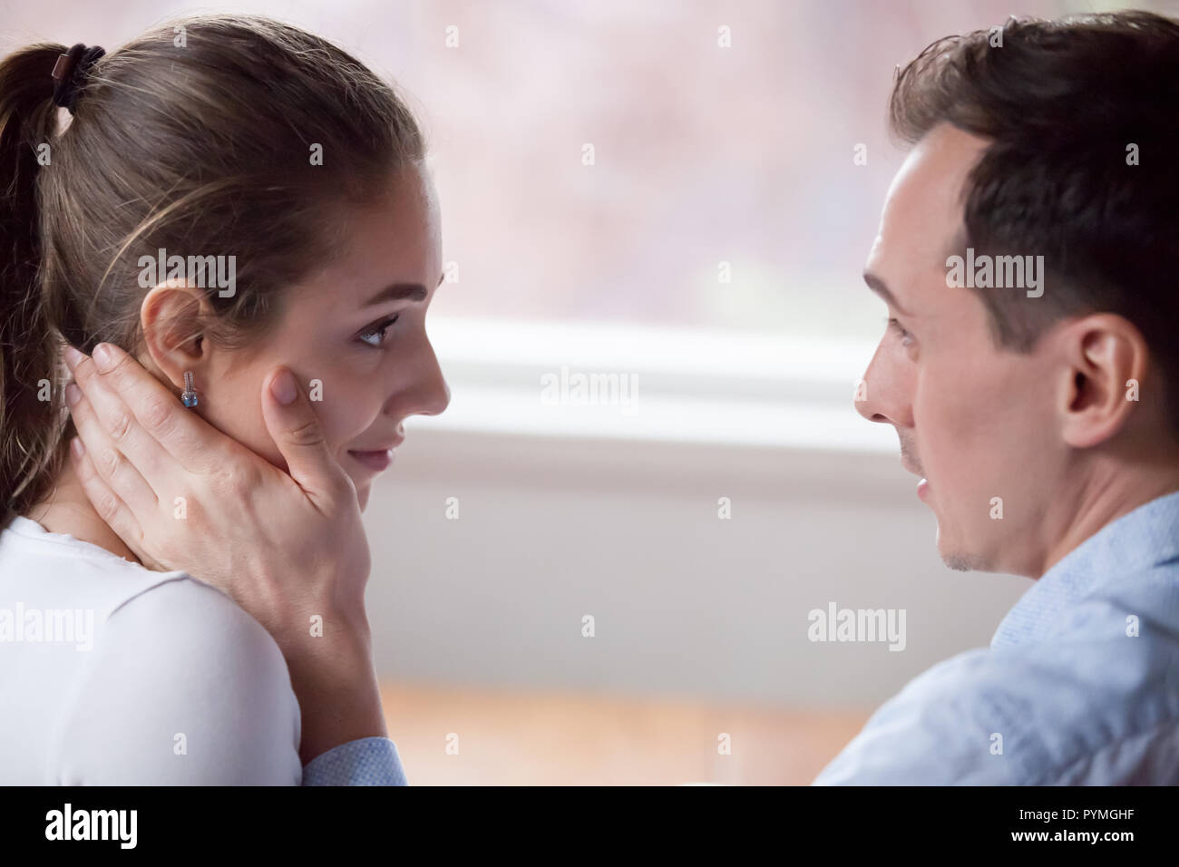 Couple looking at each other with love and tender Stock Photo