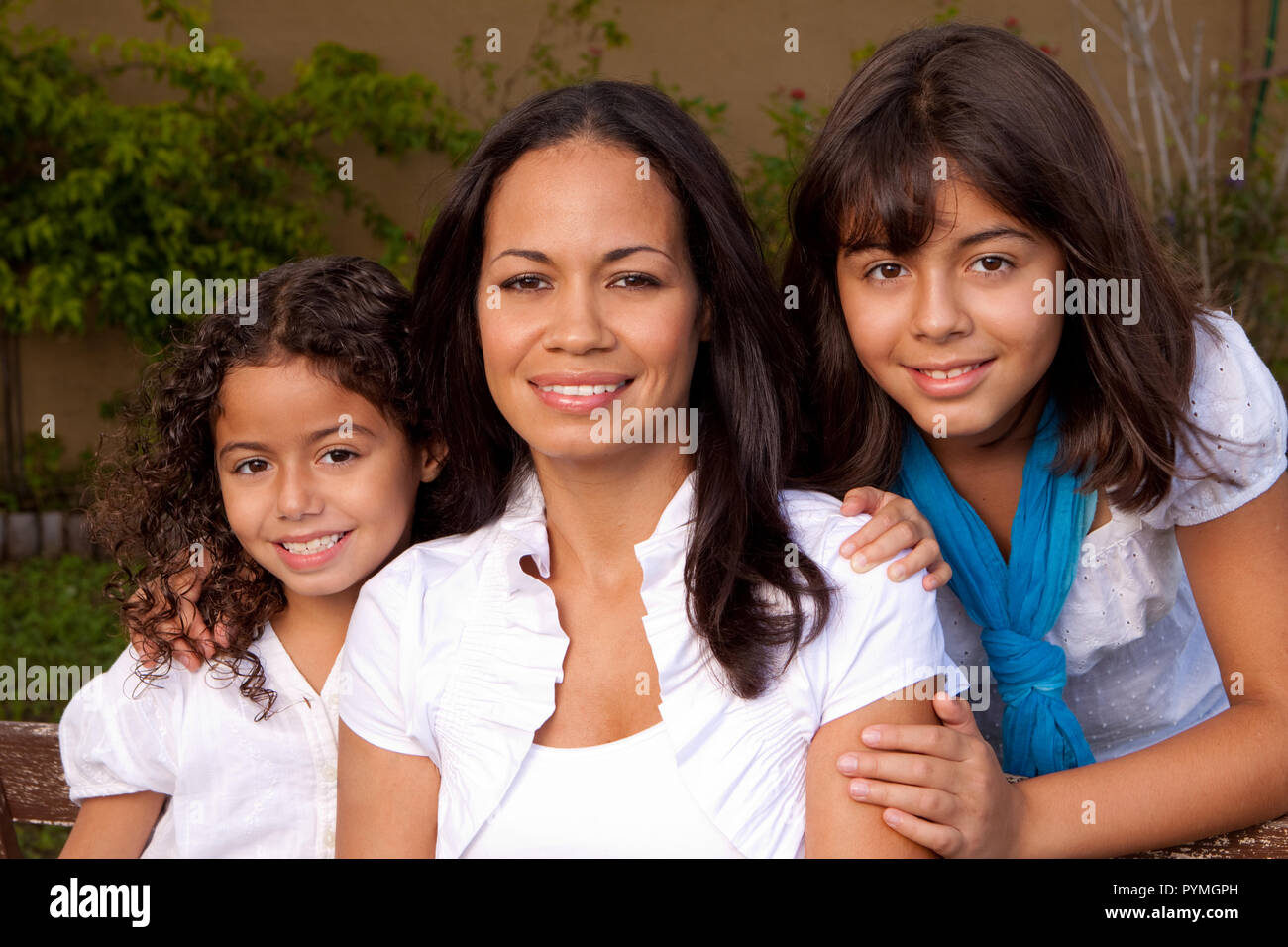 Happy Hispanic family smiling laughing Stock Photo - Alamy