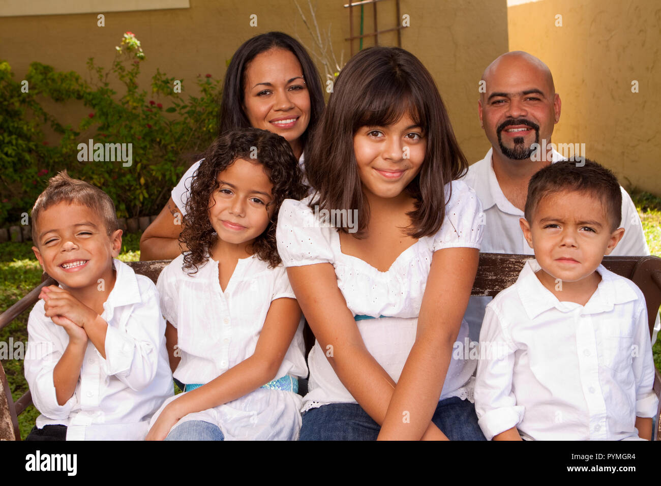 Happy Hispanic family smiling laughing Stock Photo - Alamy
