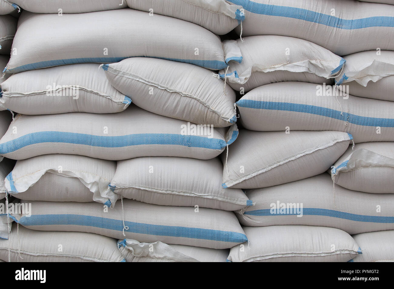 Bags with grains in stacks close-up Stock Photo