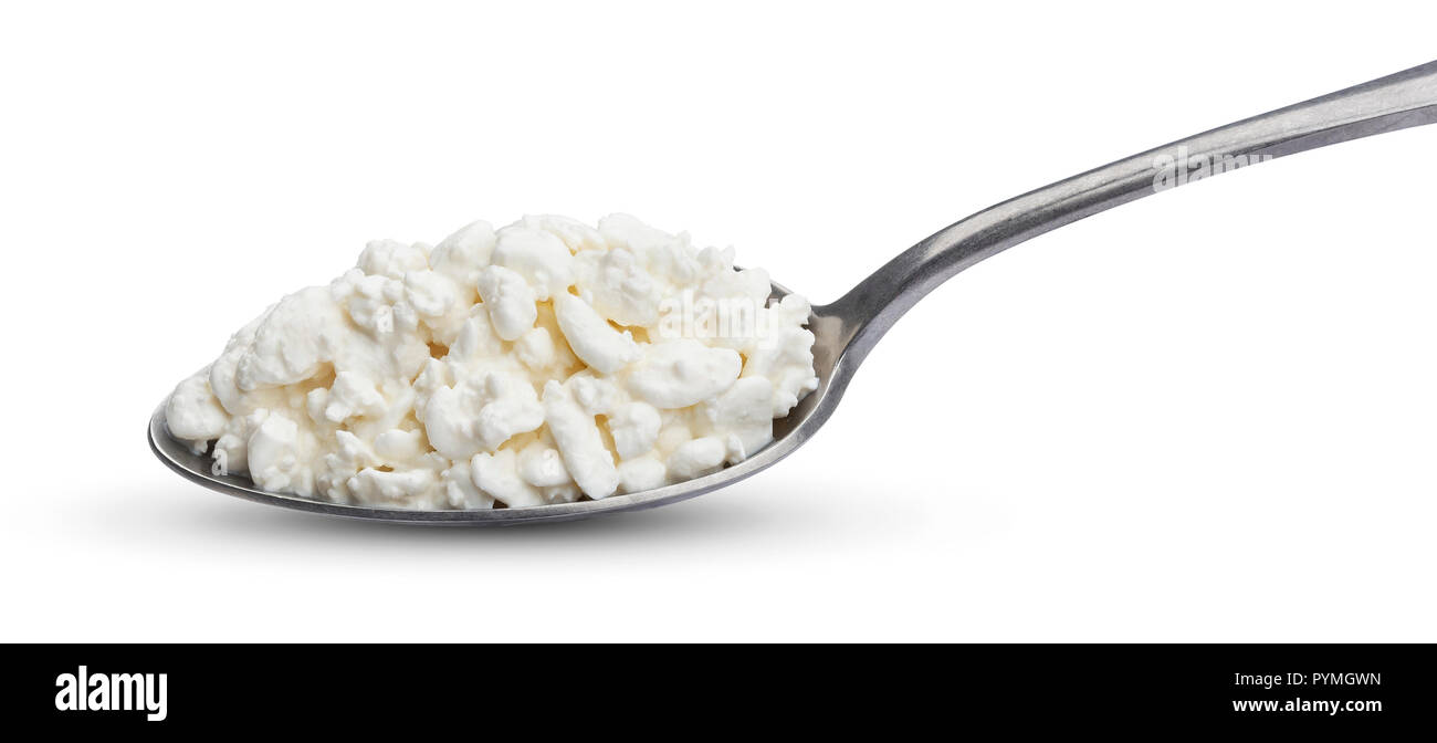 Cottage cheese in spoon isolated on white background Stock Photo