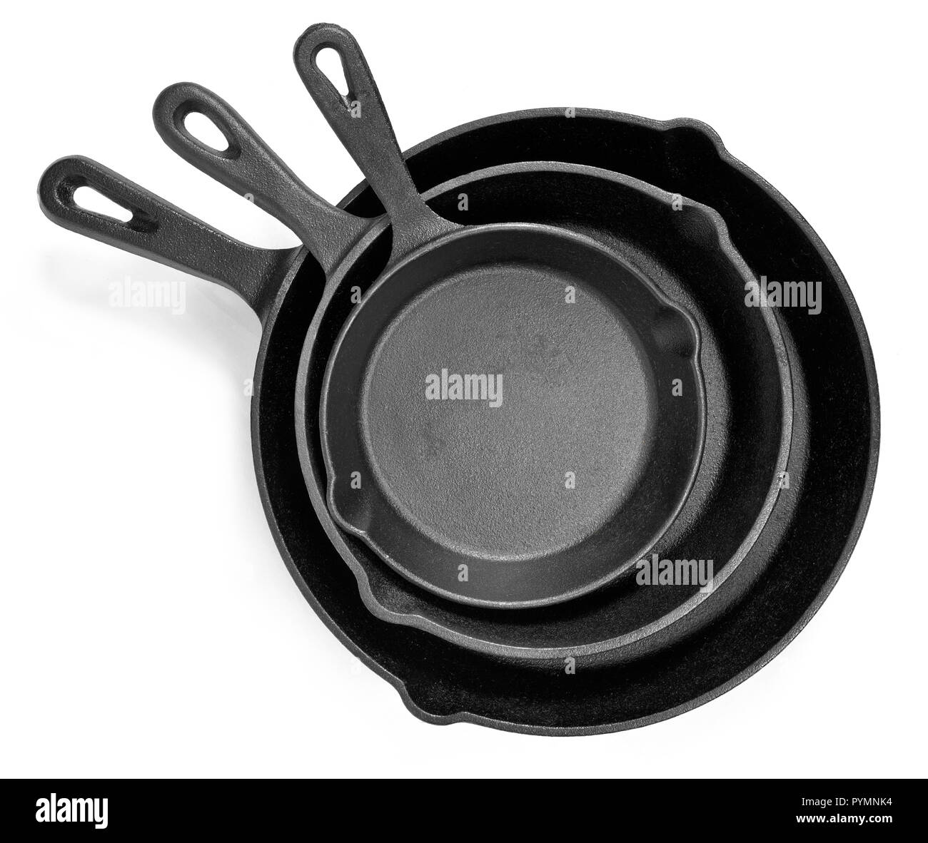 Cast iron pans with empty space, isolated on white background. Cut out objects with top view or high angle view and copy space. Stock Photo