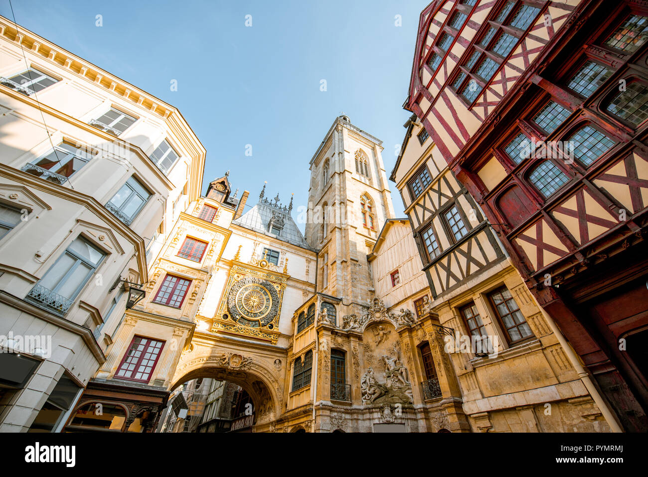 Street view with ancient buildings and Great clock on renaissance arch, famous astronomical clock in Rouen, the capital of Normandy region Stock Photo