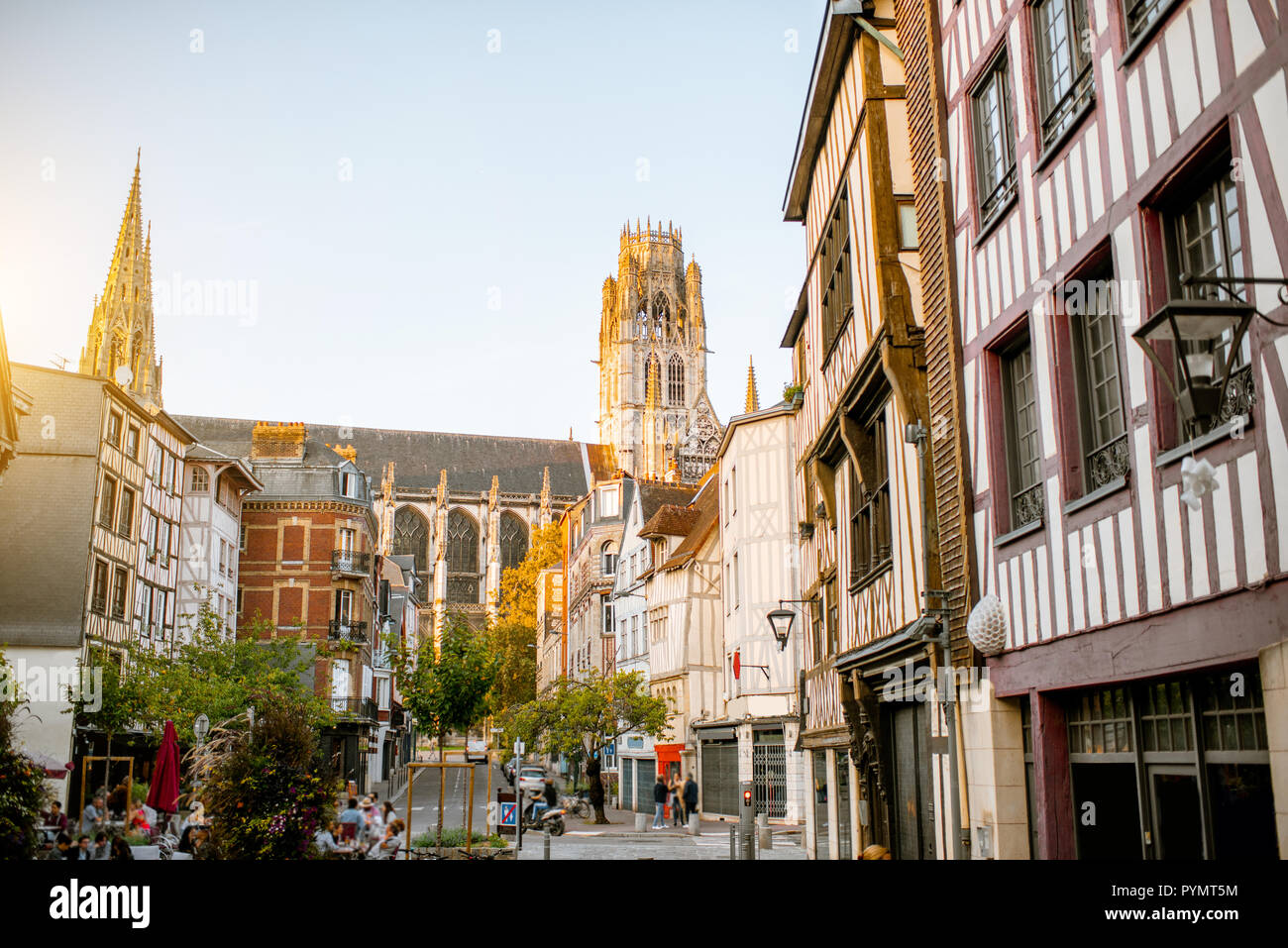 Street view with beautiful old buildings and cathedral tower on the ...