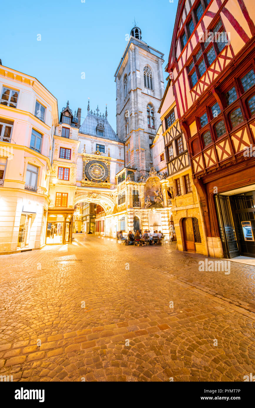 Street view with illuminated buildings and famous clock tower during ...