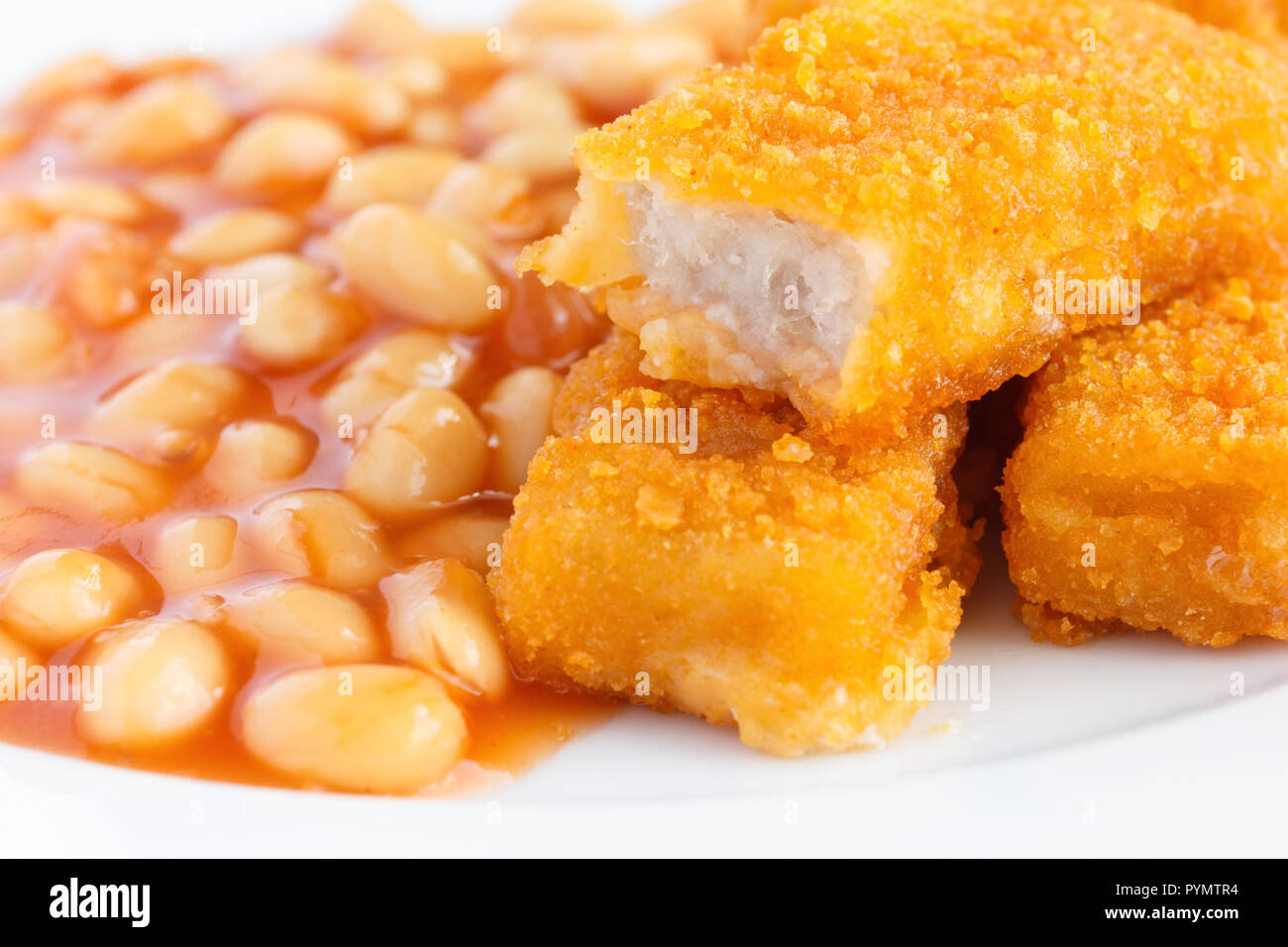 Plate of baked beans with fried fishfingers Stock Photo Alamy