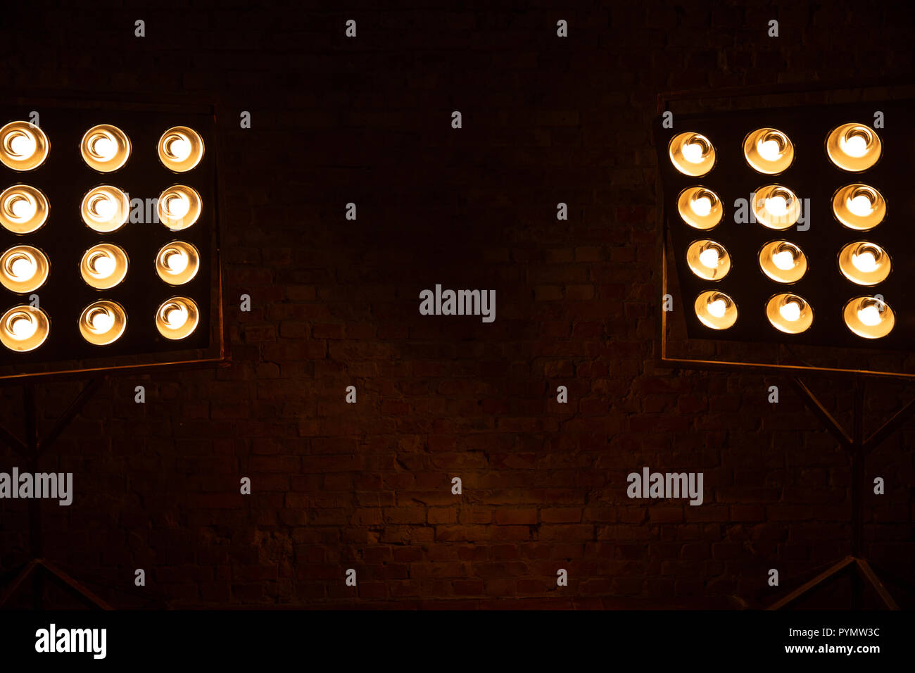 Dark background with spotlights. Brick wall. Copy space Stock Photo
