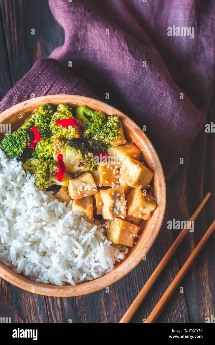 Tofu and broccoli stirfry with white rice Stock Photo Alamy