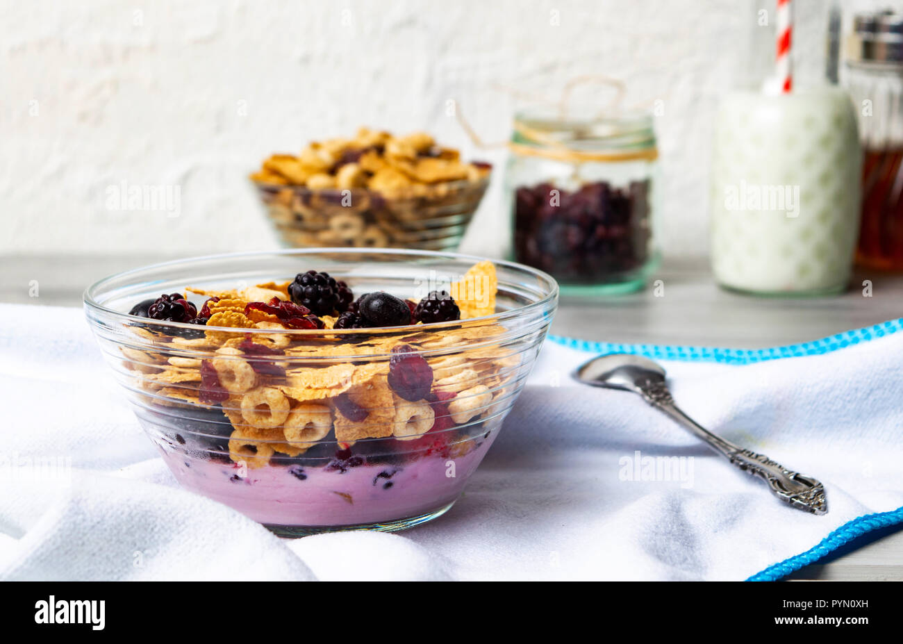 Breakfast cereals milk and with berry fruits in bowl Stock Photo
