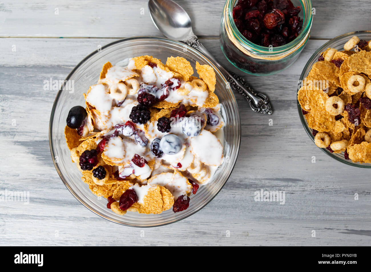 Breakfast cereals milk and with berry fruits in bowl Stock Photo