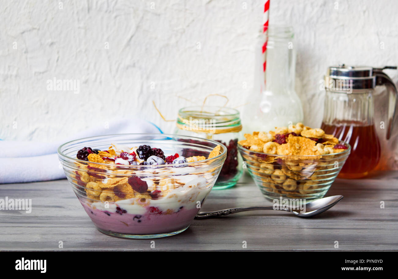 Breakfast cereals milk and with berry fruits in bowl Stock Photo