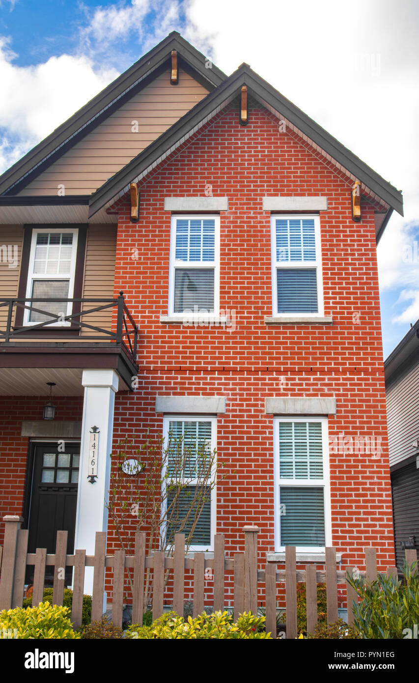 Red brick homes side by side. Row of Typical English Terraced Houses