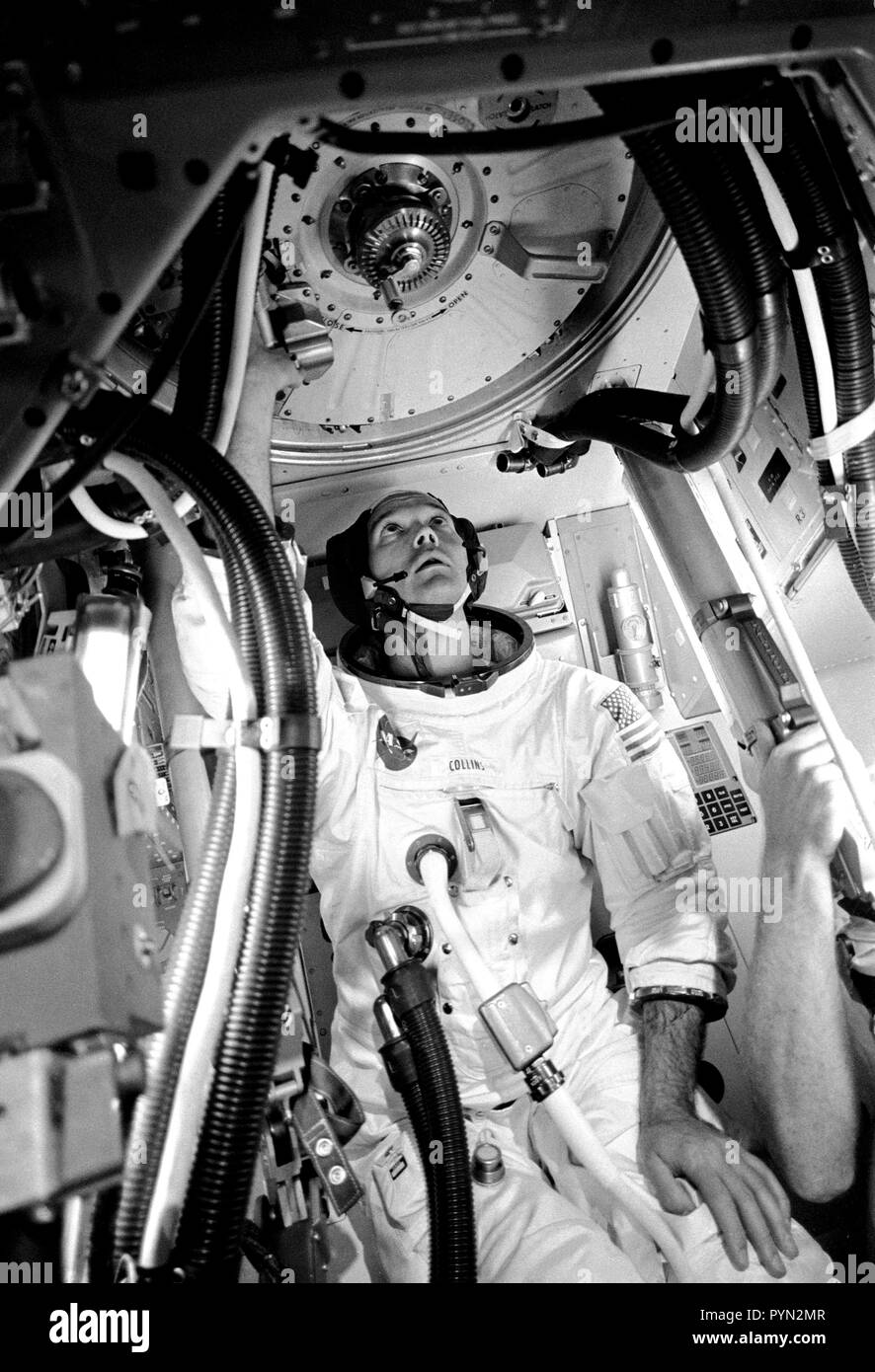 Astronaut Michael Collins, command module pilot of the Apollo 11 flight, is seen inside an Apollo Command Module (CM) mockup in Building 5 practicing procedures with the Apollo docking mechanism in preparation for the scheduled Apollo 11 lunar landing mission. Stock Photo
