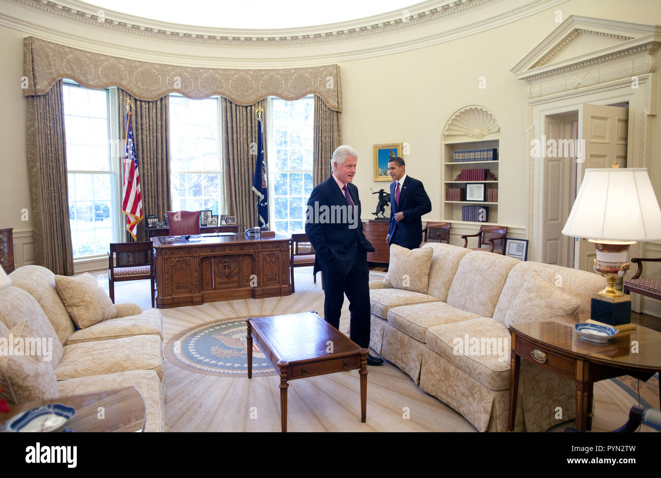 President Barack Obama meets with President Clinton in the Oval Office 4/21/09 Stock Photo