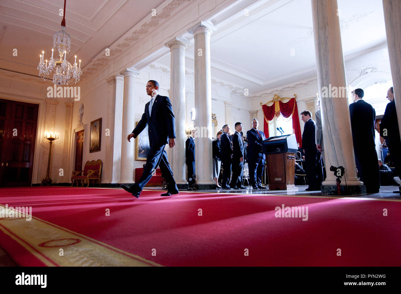 President Barack Obama walks away from the podium after delivering a statement regarding the American auto industry in the Cross Hall, Grand Foyer of the White House. Stock Photo